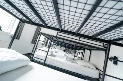 a room with two bunk beds in a building at The ASH in Antwerp