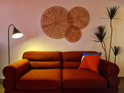 a brown couch in a living room with a lamp at Hakuna Matata @ Opera in Antwerp