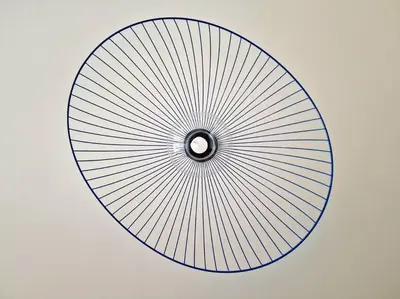 a large circular object with lines on a wall at Hakuna Matata @ Opera in Antwerp