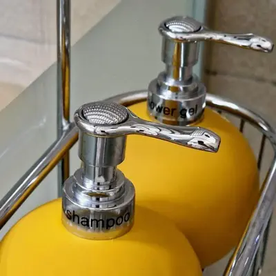 a metal faucet on top of a yellow object at Hakuna Matata @ Opera in Antwerp