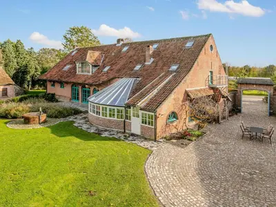 an aerial view of a large brick building with a roof at Alverwege 2 in Merksplas