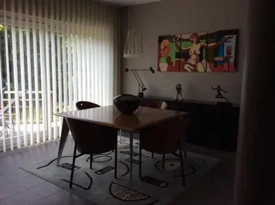 a dining room with a table and some chairs at B&B Uccle in Brussels