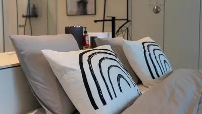 a group of white pillows sitting on a couch at Sky loft - Luxurious Penthouse - Antwerp 180 m² in Antwerp
