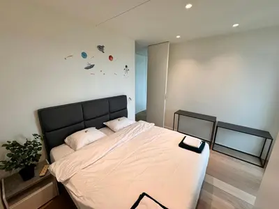 a bedroom with a large bed with two pillows at Sky loft - Luxurious Penthouse - Antwerp 180 m² in Antwerp