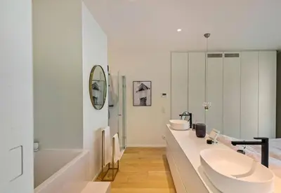 a white bathroom with two sinks and a tub at Sky loft - Luxurious Penthouse - Antwerp 180 m² in Antwerp