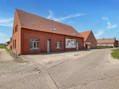 a red brick building with a road in front of it at In de Wollekjes in Merksplas