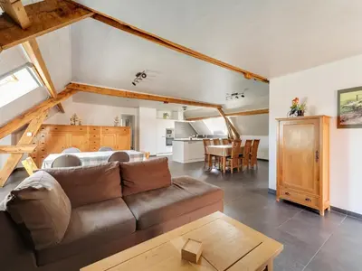 a living room with a couch and a table at In de Wollekjes in Merksplas