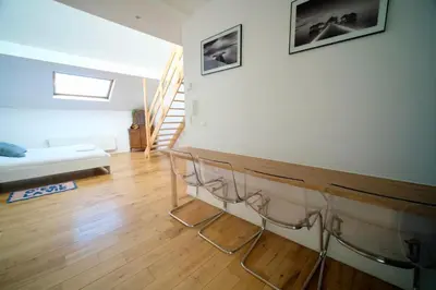 a living room with a table and a couch at Easy Stay - City Center in Brussels