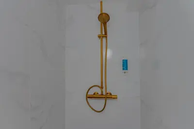 a shower in a bathroom with a shower head at Easy Stay - City Center in Brussels