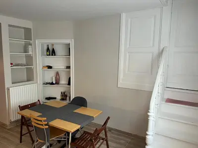 a dining room with a table and chairs at Stay in maison de metre in Etterbeek in Brussels