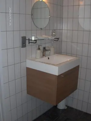 a bathroom with a sink and a mirror at Wenceslas Cobergher II Appartementen 2 of 4 in Boutersem