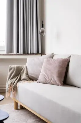 a white couch in a living room with a window at Urban Cityflats - Center Antwerp in Antwerp