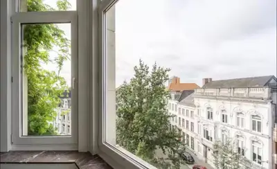 an open window with a view of a building at Urban Cityflats - Center Antwerp in Antwerp