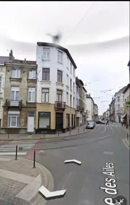 a street with a white building on the side of the road at Ailes Center 3 in Brussels