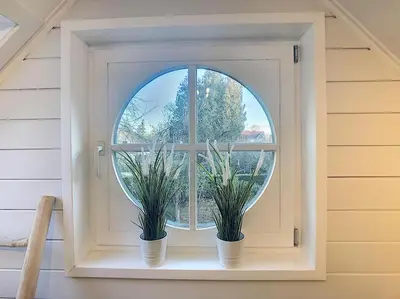 two potted plants sitting on a window sill at Cottage en bordure bruxelloise in Wezembeek-Oppem