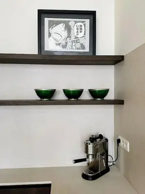 three green bowls sitting on a shelf above a mixer at Gezellig gerenoveerd herenhuis in het centrum in Antwerp