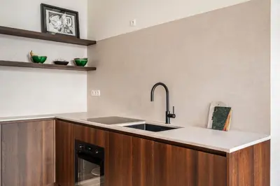 a kitchen with a sink and a counter at Gezellig gerenoveerd herenhuis in het centrum in Antwerp