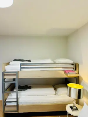 a bedroom with a bunk bed with a yellow lamp at Urbanstay Suites Grand Place Luxury Apartment in Brussels