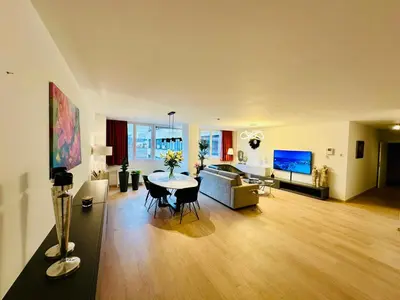 a living room with a table and a couch at Urbanstay Suites Grand Place Luxury Apartment in Brussels