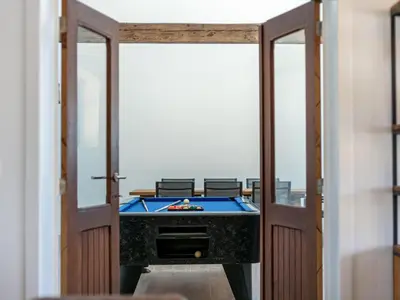 a room with a pool table on the balcony at Lindehoeve in Turnhout