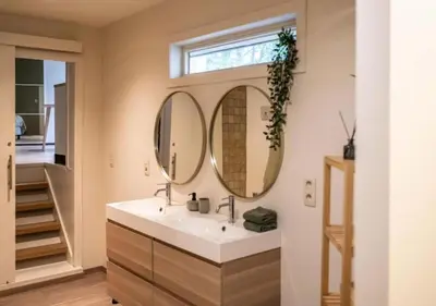 a bathroom with a sink and a mirror at Cozy 3BR Home near Meir in Antwerp City Centre in Antwerp