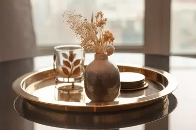 a tray with a vase and a glass on a table at The Wonder Shore in Antwerp