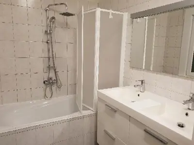 a bathroom with a tub and a sink and a shower at COSY HOUSE 6BEDROOMS GARDEN in Mortsel
