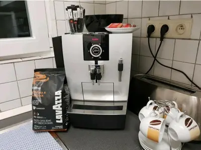 a coffee maker on a counter in a kitchen at COSY HOUSE 6BEDROOMS GARDEN in Mortsel