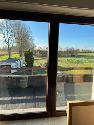 a view of a field from a window at White House in Ternat