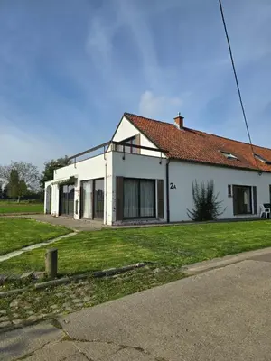 a white house with a red roof at White House in Ternat
