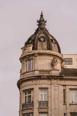 a building with a dome on top of it at Hotel Fleur de Ville in Brussels