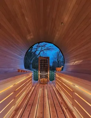 an inside of a sauna with a door in it at BNB Green refuge: Vakantiehuis met zeer grote tuin in Londerzeel