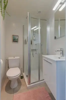 a bathroom with a toilet and a shower and a sink at Cosy duplex nearby city centre of Ghent for 6 in Ghent