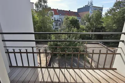 a balcony with a view of a city at Elegant Flat Cinquantenaire in Brussels