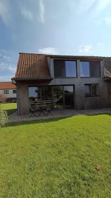 a house with a picnic table in front of it at Huis Belijn in Lokeren