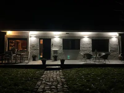 a house with lights on it at night at Kokoon in 't groen in Leuven