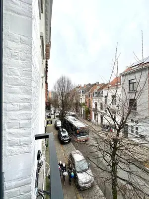 a view of a city street with cars and buses at My Haus European Commision in Brussels