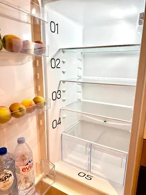 an open refrigerator with a bottle of water in it at My Haus European Commision in Brussels