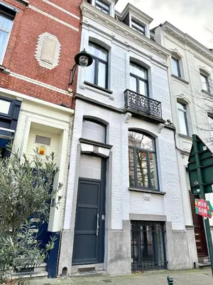 a building with a blue door on a street at My Haus European Commision in Brussels