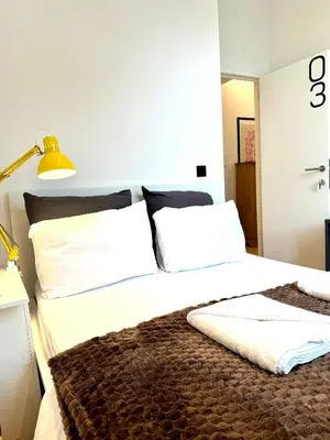 a bedroom with two beds with white pillows at My Haus European Commision in Brussels