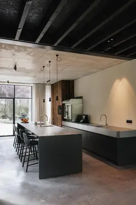 a kitchen with a large island in a room at Schuur 80 in Haasdonk