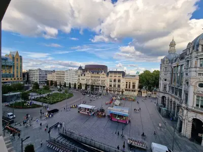 a city square with a street with buses and buildings at Stunning View + Japan Design Bed @ Central Station in Antwerp