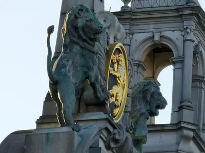 a statue of a lion on the side of a building at Stunning View + Japan Design Bed @ Central Station in Antwerp