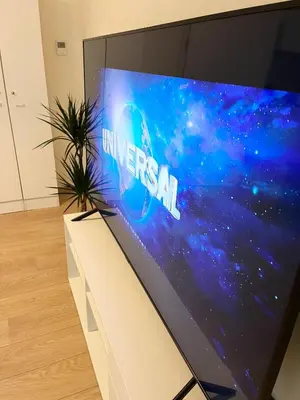 a large screen tv with the amazon logo on it at Elegant flat - Center of Brussels in Brussels