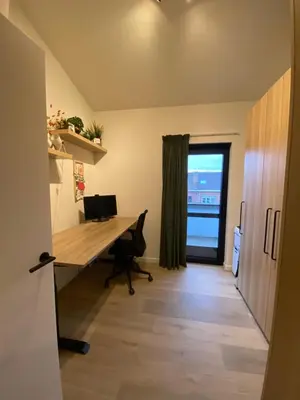 an office with a desk and a window at Luxury & cozy apartment in Lubbeek