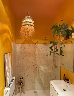 a bathroom with a shower with a sink and a mirror at Kleurrijke nieuwe woonst in hartje Antwerpen in Antwerp