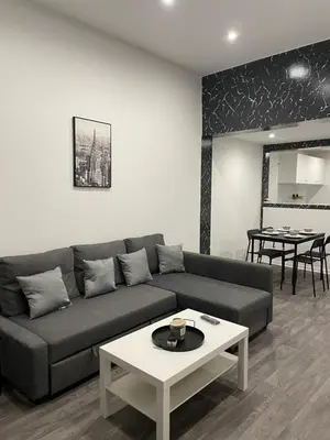 a living room with a couch and a table at Appartement au cœur de Bruxelles in Brussels