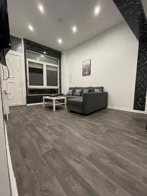 a living room with a couch and a table at Appartement au cœur de Bruxelles in Brussels