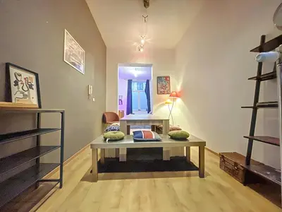 a room with a table with pillows on it at Family Stays Flagey in Brussels