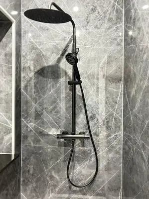 a shower with a shower head in a bathroom at Magnifique duplex in Brussels